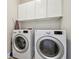 Clean laundry room with full-sized washing machine and dryer at 21205 Calle Rosa Dr # 10, Land O Lakes, FL 34637