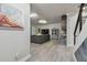 Inviting living room showcases modern design with gray sectional, wood-look floors, and elegant art pieces at 21205 Calle Rosa Dr # 10, Land O Lakes, FL 34637