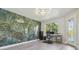 Stylish home office with a decorative accent wall and a bright window at 21205 Calle Rosa Dr # 10, Land O Lakes, FL 34637