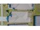 Aerial view of the home's roof with surrounding manicured lawn and landscaping at 2514 Sandy Hill Ct, Holiday, FL 34691