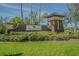 Stone community sign for Key Vista with a well-manicured lawn and landscaping at 2514 Sandy Hill Ct, Holiday, FL 34691