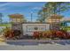 Community entrance sign 'Vista Point' with colorful landscaping at 2514 Sandy Hill Ct, Holiday, FL 34691