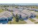 Aerial view of a well-kept home with a landscaped yard, two-car garage, and lovely curb appeal at 2514 Sandy Hill Ct, Holiday, FL 34691