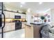 Well-lit kitchen features tile floor, granite counters, and stainless steel appliances at 2514 Sandy Hill Ct, Holiday, FL 34691