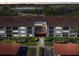 This aerial view showcases the well-maintained building with lush landscaping and ample parking at 2595 Countryside Blvd # 8-305, Clearwater, FL 33761