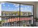 Relaxing screened balcony, complete with plants, boasting views of a manicured landscape at 2595 Countryside Blvd # 8-305, Clearwater, FL 33761