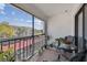 Relaxing screened balcony, complete with table and chairs, boasting views of a manicured landscape at 2595 Countryside Blvd # 8-305, Clearwater, FL 33761