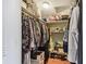 Walk-in closet with shelving and hanging rods providing ample storage space at 2595 Countryside Blvd # 8-305, Clearwater, FL 33761