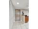 Entryway view features tile flooring, storage and access to additional rooms at 2595 Countryside Blvd # 8-305, Clearwater, FL 33761