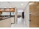 Entryway of home shows a view into the kitchen and living room beyond, with bright tile floors at 2595 Countryside Blvd # 8-305, Clearwater, FL 33761