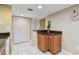 Cozy entryway with tile flooring, storage and a partial view of the living area at 2595 Countryside Blvd # 8-305, Clearwater, FL 33761