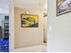 Hallway featuring neutral paint and art at 2595 Countryside Blvd # 8-305, Clearwater, FL 33761