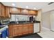 Updated kitchen with granite countertops and views into the living area at 2595 Countryside Blvd # 8-305, Clearwater, FL 33761