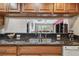 Open concept kitchen with granite counters offering views to the living room at 2595 Countryside Blvd # 8-305, Clearwater, FL 33761