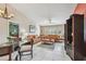 Open living room featuring neutral paint, white tile floors, dining table and comfortable seating at 2595 Countryside Blvd # 8-305, Clearwater, FL 33761