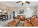 Inviting living room with neutral tones and access to the dining and kitchen areas at 2595 Countryside Blvd # 8-305, Clearwater, FL 33761