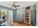 Office space with natural lighting featuring a ceiling fan and access to outdoor balcony at 2595 Countryside Blvd # 8-305, Clearwater, FL 33761