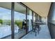 Spacious balcony with ample seating and an open view to the living space inside at 3211 W Swann Ave # 602, Tampa, FL 33609