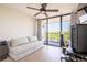 Comfortable bedroom with balcony access, perfect for relaxing and enjoying the view at 3211 W Swann Ave # 602, Tampa, FL 33609