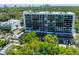Exterior view of the building with trees surrounding the area at 3211 W Swann Ave # 602, Tampa, FL 33609