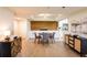 Stylish dining area adjacent to the kitchen with wood accent wall, and views of other living spaces at 3211 W Swann Ave # 602, Tampa, FL 33609