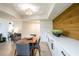 Well-lit dining space with modern furnishings, wood accent wall, and easy access to the bedroom at 3211 W Swann Ave # 602, Tampa, FL 33609