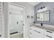 Stylish bathroom featuring white vanity, modern fixtures, and glass-enclosed shower at 3214 40Th W St, Bradenton, FL 34205