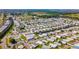 A high-angle view displays waterfront homes situated on canals, offering convenient access to the bay and recreational activities at 328 S Port Royal Ln, Apollo Beach, FL 33572