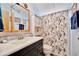 Bathroom featuring a black vanity with lots of storage and a shower at 328 S Port Royal Ln, Apollo Beach, FL 33572