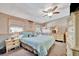 Spacious bedroom with carpeted floors, complemented by a ceiling fan and a comfortable double bed at 328 S Port Royal Ln, Apollo Beach, FL 33572