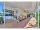 Inviting home exterior with covered carport and sunroom, all under a covered porch entrance at 328 S Port Royal Ln, Apollo Beach, FL 33572