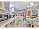 Efficient kitchen with white appliances, a breakfast nook, and tile backsplash at 328 S Port Royal Ln, Apollo Beach, FL 33572