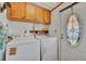 Convenient laundry room with washer, dryer, and exterior access at 328 S Port Royal Ln, Apollo Beach, FL 33572