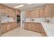 Spacious kitchen featuring light wood cabinets and tile countertops with stainless steel appliances at 3330 San Bernadino St, Clearwater, FL 33759