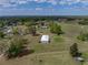 Expansive acreage with mature trees, a metal outbuilding and space for recreation at 39745 River Rd, Dade City, FL 33525