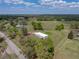 Aerial view of home and lot situated on sprawling acreage offering privacy and a serene setting at 39745 River Rd, Dade City, FL 33525