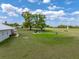 Expansive backyard with mature trees and a charming gazebo, perfect for outdoor entertaining at 39745 River Rd, Dade City, FL 33525