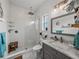 Updated bathroom featuring a rainfall shower head, and modern fixtures for a spa-like experience at 39745 River Rd, Dade City, FL 33525
