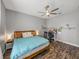 Serene bedroom featuring neutral walls, wood-look floors, and ample space for work or relaxation at 39745 River Rd, Dade City, FL 33525