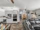 Open-concept living room and kitchen combination offering plenty of natural light and neutral colors at 39745 River Rd, Dade City, FL 33525