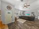 Spacious living room features wood-look floors, a decorative wheel, and modern decor at 39745 River Rd, Dade City, FL 33525
