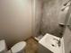 Bathroom featuring a modern vanity, tiled shower, and neutral wall paint at 4033 Newcastle Dr, New Port Richey, FL 34652