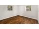 Bedroom with two windows and hardwood floors at 4421 W Iowa Ave, Tampa, FL 33616