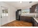 Well-equipped kitchen with dark cabinets, stainless appliances, and a practical layout at 4421 W Iowa Ave, Tampa, FL 33616