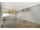 Enclosed patio with screening and concrete flooring at 4421 W Iowa Ave, Tampa, FL 33616