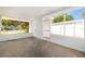 Screened-in patio with concrete flooring and white trim at 4421 W Iowa Ave, Tampa, FL 33616