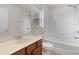 Clean bathroom features a tub, shower, and vanity with stylish fixtures at 4515 Fieldview Cir, Wesley Chapel, FL 33545
