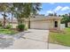 Charming home exterior with a lush green lawn and well-maintained landscaping at 4515 Fieldview Cir, Wesley Chapel, FL 33545