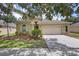 Inviting single-story house with a lush green lawn and attached two-car garage at 4515 Fieldview Cir, Wesley Chapel, FL 33545