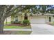 Charming single-story home featuring a well-manicured lawn and a two-car garage at 4515 Fieldview Cir, Wesley Chapel, FL 33545